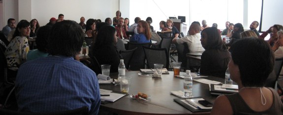 Audience members listening to comments.