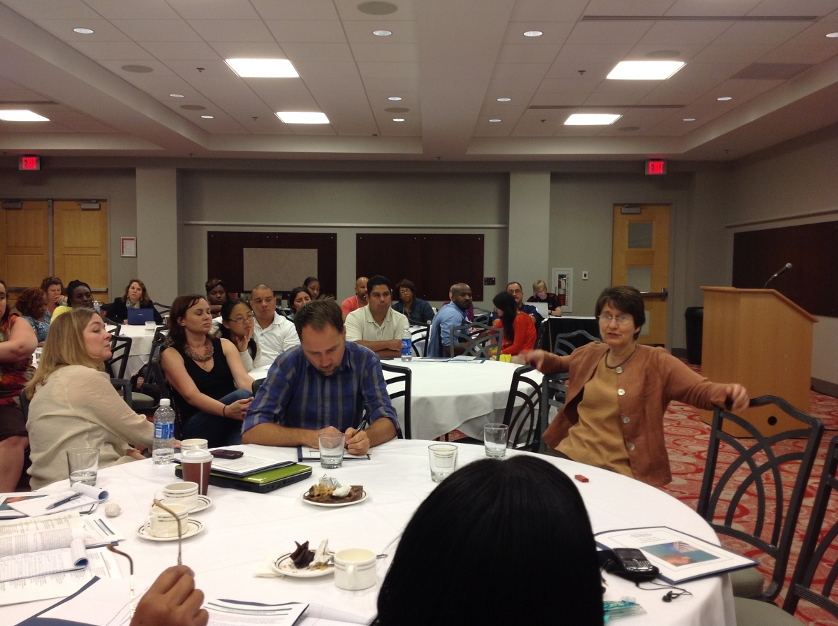 Discussions, Facing L to R at forefront table: Jody Miller, Christopher Lyons and Laurie Krivo