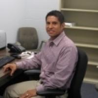 Jorge Chavez sitting in office