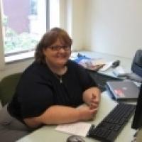 Amy Poland sitting at desk