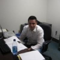 Claudio Vera Sanchez sitting at desk