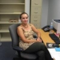 Elizabeth Trejos-Castillo sitting at desk