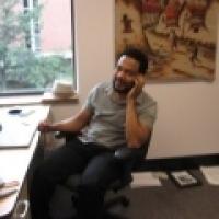 John Eason sitting at desk