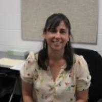 Maria Velez sitting in chair