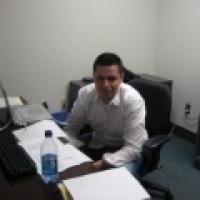 Claudio Vera Sanchez sitting at desk