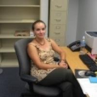 Elizabeth Trejos-Castillo sitting at desk