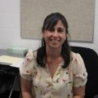 Maria Velez sitting in chair