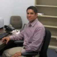 Jorge Chavez sitting in office