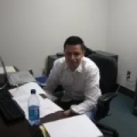 Claudio Vera Sanchez sitting at desk