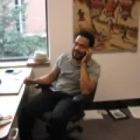 John Eason sitting at desk